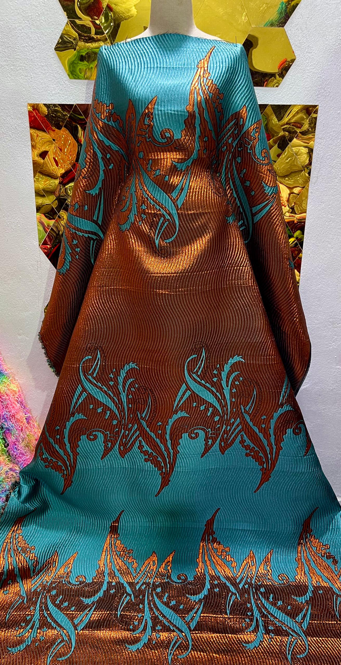 Teal and copper brocade .    Selling by yards